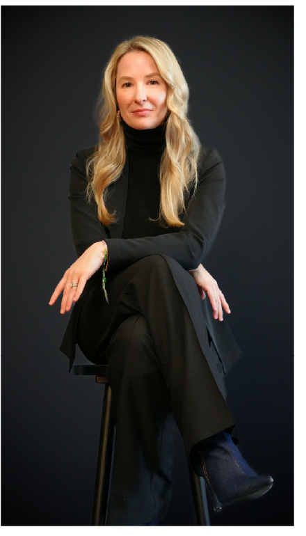 Dr. Mindy Paradise seated against a dark background